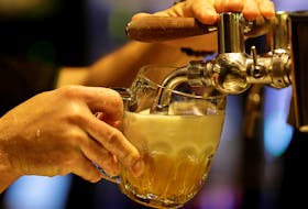 A bartender pours a glass of beer inside of a new conceptual pub by Plzensky Prazdroj (Pilsner Urquell) brewery called Plzenka in Prague, Czech Republic, May 6, 2019.