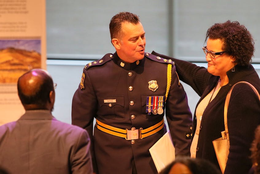 FOR CAMPBELL STORY:
Halifax Regional Police Chief Dan Kinsella gets a pat on the back from Halifax police commission chairwoman Natalie Borden after giving an apology for his department's street check policy, during a public event at the Halifax Public Library Friday November 29, 2019. 

TIM KROCHAK/ The Chronicle Herald
