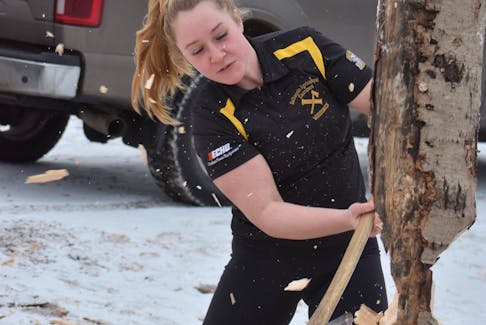 Marissa Albright lines up a practice shot with her ax as she and her team train for the upcoming Rick Russell Woodsmen Competition on Feb. 8. FRAM DINSHAW/TRURO NEWS