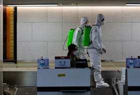 South Korean soldiers spray disinfectant at the international airport amid the rise in confirmed cases of coronavirus disease (COVID-19) in Daegu, South Korea on Friday. REUTERS/Kim Kyung-Hoon
