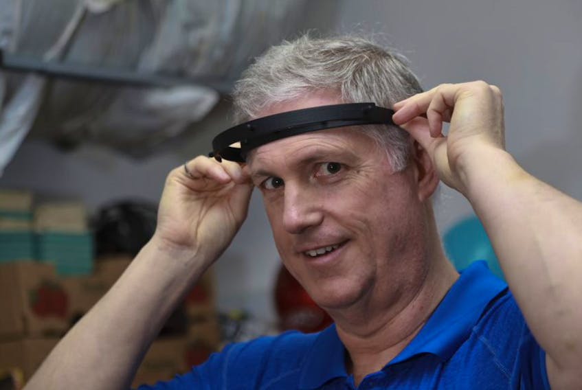 Dalhousie University professor Clifton Johnston shows off a prototype of a headbands he and other engineers are 3D printing. They are making face shields to help bridge a possible shortage if the Nova Scotia Health Authority needs them.