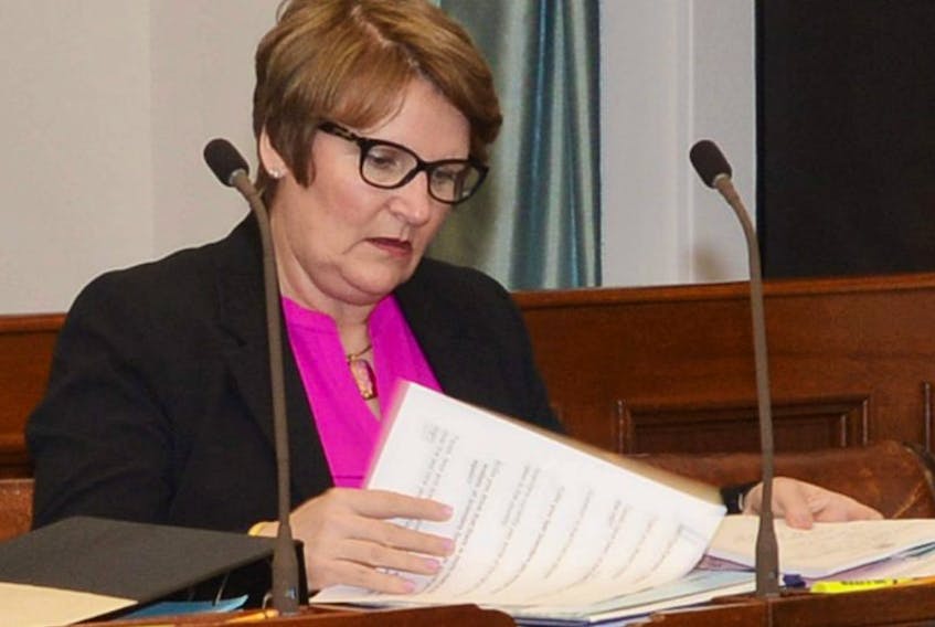 Darlene Comptom, MLA for Belfast-Murray River, sorts through some papers before the start of legislature this week. <br /><br />
