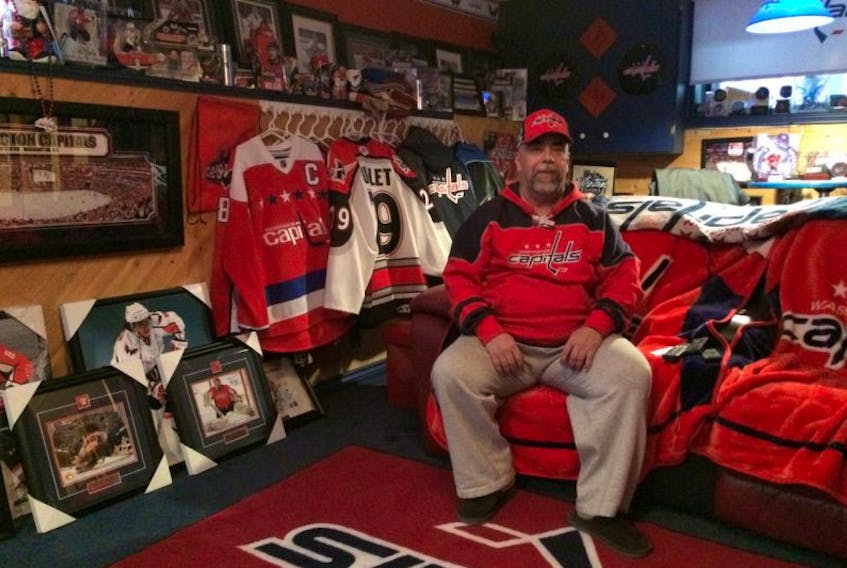 Dave Dowden sits among a plethora of Washington Capitals memorabilia in the man-cave of his St. John’s home. Dowden has cheered for the Capitals for more than 40 years, beginning in 1974-75 when two Newfoundlanders suited up for Washington.