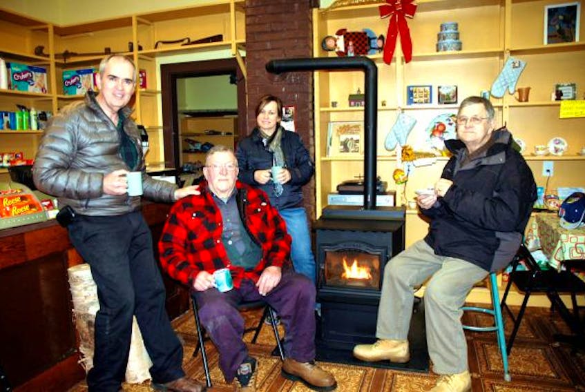 From left, Eric Whyte, Robert Grant, Sandra MacLeod and Lloyd Grant take a moment to enjoy a cup of tea at Grant’s General Store in Boulardarie, in this photo from the January 2011 edition of the Cape Breton Post. CAPE BRETON POST