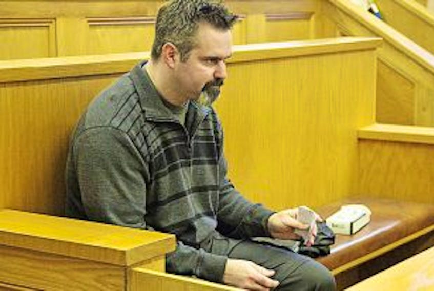 ['Telegram file photo<br />David Folker&nbsp; is shown in court in a 2013 photo.']