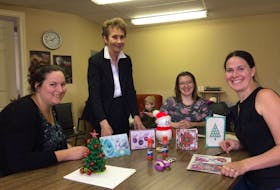 Miranda MacLean and Roberta Journeay of the Tri-County Women’s Resource Centre talk to Rachel Dondale and Debbie Haight of Digby Care 25 about a Christmas craft workshop they were holding in Digby.