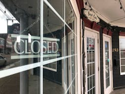 A closed sign as seen through the window of a downtown Sydney restaurant.  GREG MCNEIL/CAPE BRETON POST