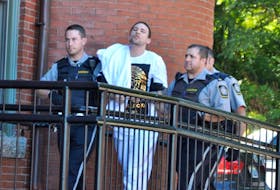 <p>Provincial sheriffs lead Justin Dempster into the Digby provincial courthouse for his sentencing hearing Sept. 20.</p>