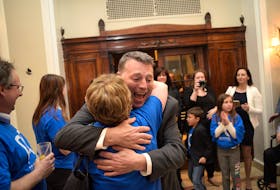 PC leader Dennis King hugs a supporter after arriving at a PC watch party at the Rodd Charlottetown on Tuesday night. King lead the PCs to a strong finished, with the party winning 12 seats. King is expected to lead a minority government.