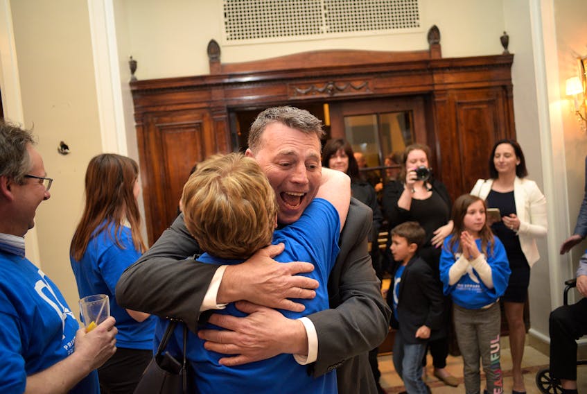 PC leader Dennis King hugs a supporter after arriving at a PC watch party at the Rodd Charlottetown on Tuesday night. King lead the PCs to a strong finished, with the party winning 12 seats. King is expected to lead a minority government.