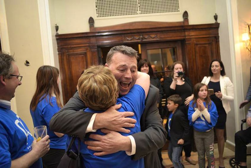 PC leader Dennis King hugs a supporter after arriving at a PC watch party at the Rodd Charlottetown on Tuesday night. King lead the PCs to a strong finished, with the party winning 12 seats. King is expected to lead a minority government. - Nathan Rochford