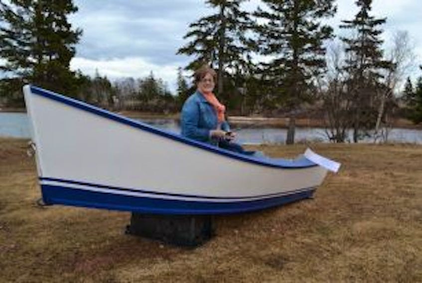 ['<p>Nadine Chaisson, organizer of the eighth annual Roy Chaisson Memorial Fishing Derby, is dangling raffle tickets on a new dory. The lottery prize will be drawn for at the conclusion of the May 14 derby. All proceeds from the derby and lottery will support the IWK Children’s Hospital.</p>']