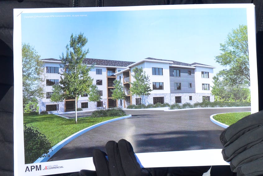 This is an artist concept drawing of what the proposed 41-unit apartment building would look like at 9, 11 and 13 Pine Dr. in Charlottetown. The building would feature a stepped roof, meaning it would be three storeys tall in one section and four storeys tall in the other. Dave Stewart/The Guardian
