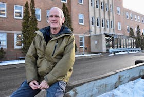 Phil Barrett sits outside the Digby General Hospital. He is part of a local committee trying to recruit doctors to Digby. TINA COMEAU PHOTO