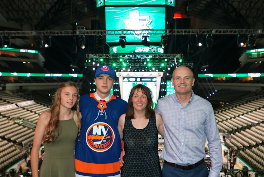 The Dobson family poses for a photo following Round 1 of the National Hockey League Entry Draft at American Airlines Center in Dallas on Friday night. From left: Elly, Noah, Jenny and Andrew. The New York Islanders selected Noah 12th overall.