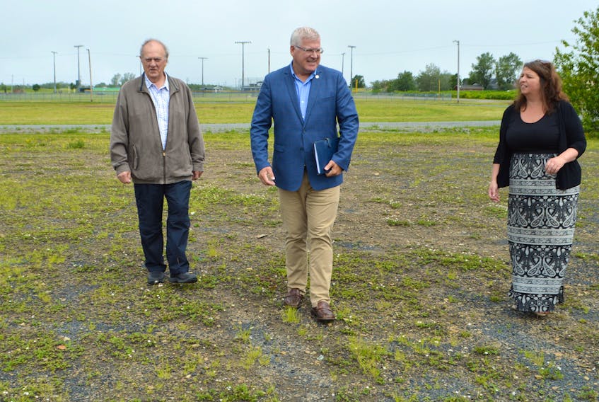 Cape Breton Regional Municipality Mayor Cecil Clarke, centre,  Dist. 1 Coun. Clarence Prince and Dist. 2 Coun. Earlene MacMullin at the Nicole Meany Memorial Ballfield on Pitt Street in Sydney Mines, where a new dog park will be built this summer. Sharon Montgomery-Dupe/Cape Breton Post 