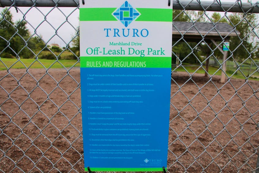 The rules are stated on three signs at the Marshland Drive dog park.