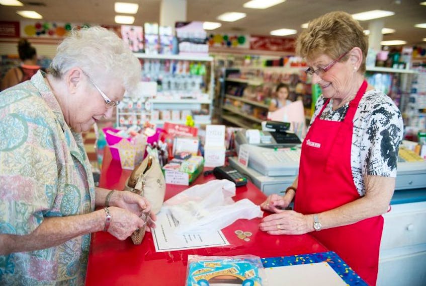 <p>Peggy Lamont is served by Pat Steele at the Great Canadian Dollar Store in Stratford Saturday. The franchise will be closing its Stratford location in October, but a search is one for a new location.</p>