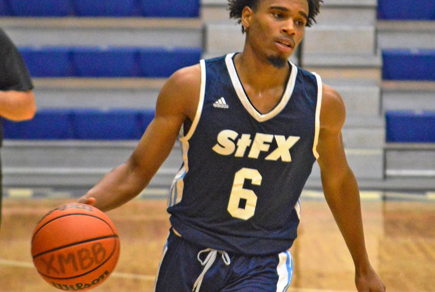 Antigonish native Dondre Reddick, shown in pre-season action versus the UNB Reds, is a freshman guard with the St. F.X. X-Men basketball team. Paul Hurford