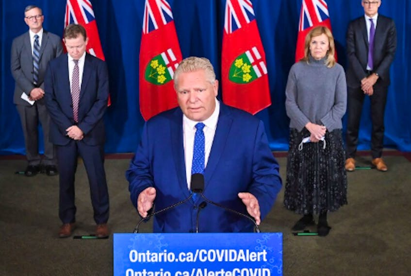 Ontario Premier Doug Ford holds a press conference with his medical team regarding new restrictions at Queen's Park during the COVID-19 pandemic in Toronto on Friday, October 2, 2020. 