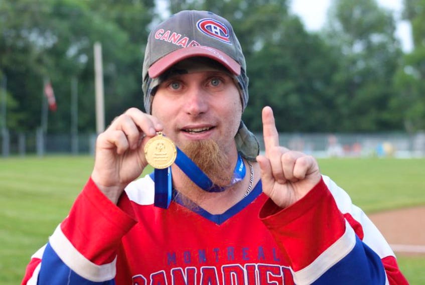 Doug Fraser shows off the gold medal he and his Kings teammates captured at the recent Special Olympics Nova Scotia provincial summer games.