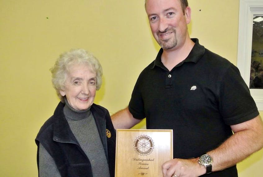 Bette Douglas is presented with the Amherst Rotary Club’s 2017 Distinguished Service Award by club president David McNairn during the club’s annual lobster dinner at Camp Tidnish on Sept. 8.