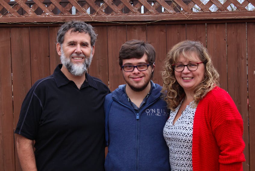 The Eddisons helped to restart the Newfoundland and Labrador Down Syndrome Society (NLDSS) in 1997. The NLDSS has helped them, as well as other families, a lot throughout the years. From left are Jamie, Nathan and Annette. — Andrew Waterman/The Telegram
