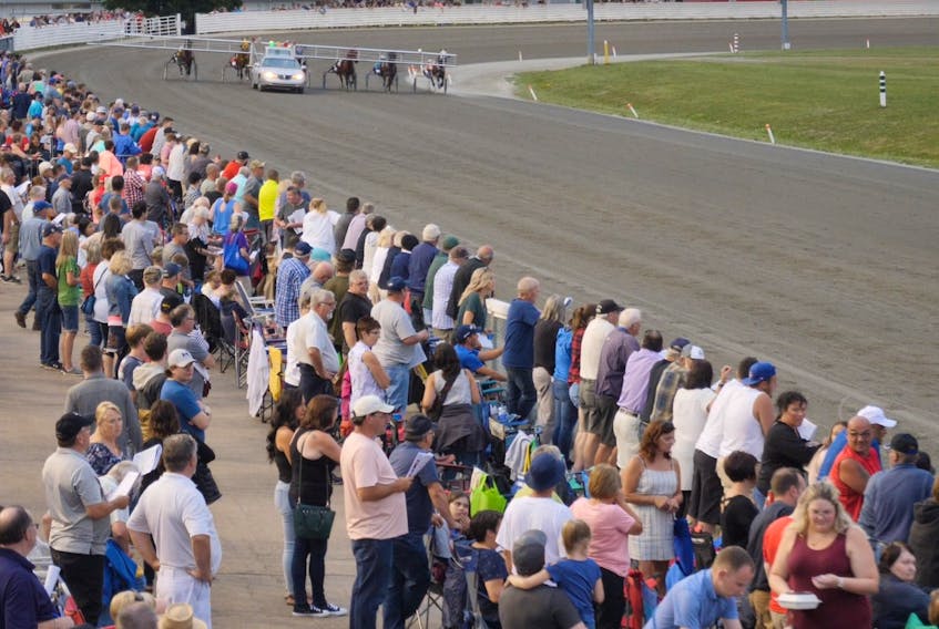 The crowd at 2019 Old Home Week prepares for the start of a race at Red Shores at the Charlottetown Driving Park. 