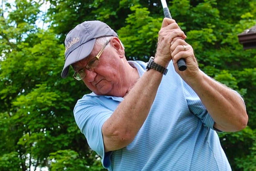 Dr. Des Colohan, seen taking a swing in the front yard of his Charlottetown home, is looking for a new place to play. He was told he is no longer wanted at Avondale Golf Course after he wrote an opinion piece that was critical of P.E.I. golf courses.