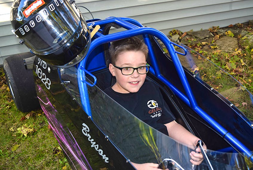 Bryson MacNeil with his dragster.