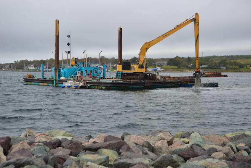 Dredging operations in Sydney harbour continued on Wednesday morning. Activities shown took place in front of the Portside Restaurant location and quite close to shore. GREG MCNEIL/CAPE BRETON POST