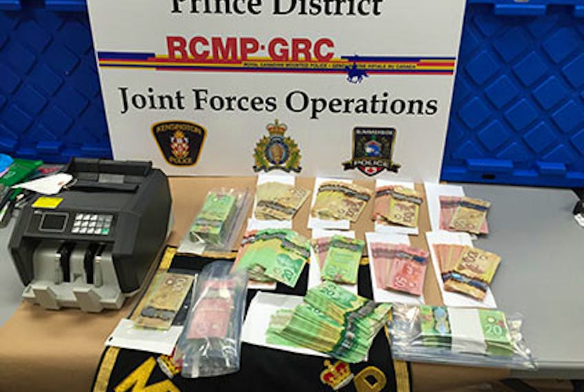 The RCMP say officers with the Prince District joint drug enforcement unit arrested two men on Feb. 19, 2021 in connection with an investigation that included the seizure of drugs, cash, contraband cigarettes and weapons.