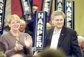 ['Prime Minister Stephen Harper and Premier Kathy Dunderdale stand together following Harper’s speech at the Delta hotel Thursday evening. Harper said if the Conservatives are re-elected, they would provide this province with a loan guarantee “or equivalent financial support” for the Lower Churchill project. — Photo by Keith Gosse/The Telegram']