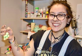 Jewelry artist in residence at the Cape Breton Centre for Craft and Design Aleena Derohanian shows an earring she has just created.