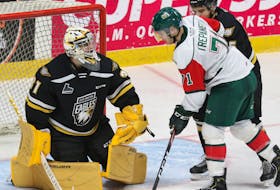 Cape Breton Eagles goalie Kevin Mandolese covers up a loose puck with Halifax Mooseheads forward Maxim Trépanier on the doorstep in this December 2019 Quebec Major Junior Hockey League file photo. The two Nova Scotia teams are expected to make moves when the league’s trade period opens this morning. CAPE BRETON POST