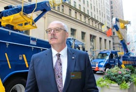 Earl Ludlow, Fortis' executive vice-president, Eastern Canadian &amp; Caribbean Operations outside the New York Stock Exchange Tuesday morning as Fortis began trading on the exchange.