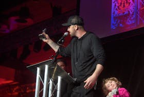Classified, with his daughter on stage, accepts the ECMA for Album of the Year during the East Coast Music Awards Show in Charlottetown on Thursday, May 2, 2019.