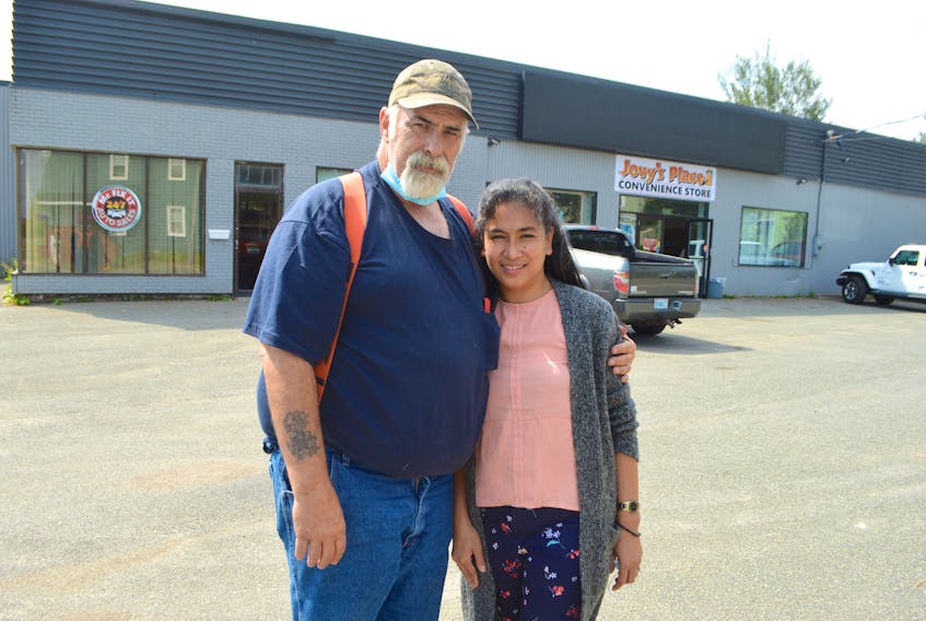 Kevin MacEachern and his wife Jovy MacEachern stand in front of Jovy’s Place and Convenience store located at 224 Dorchester St. in Sydney. The couple opened the business Aug. 8 selling everything one can think of for convenience from milk to eggs and even ‘new to you’ used cars. Sharon Montgomery-Dupe/Cape Breton Post
