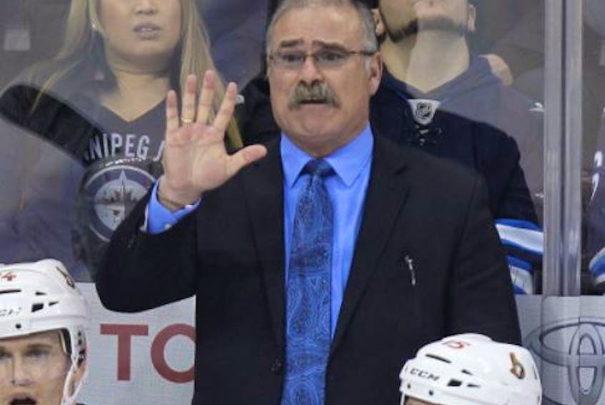 Then Ottawa Senators coach Paul MacLean argues for a penalty during a game against the Winnipeg Jets on March 8, 2014.