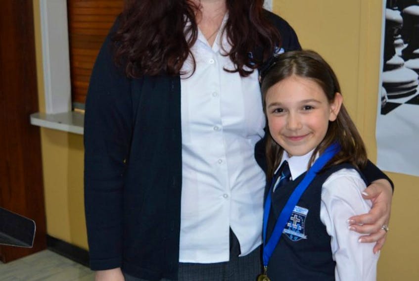 Brooke Watton (right) with her teacher, Mrs. Katie Passmoor, during the presentation of awards at the school's annual Elementary Speak Off. Brooke was chosen as the overall winner for her speech "Societies Expectations of Being a Girl".