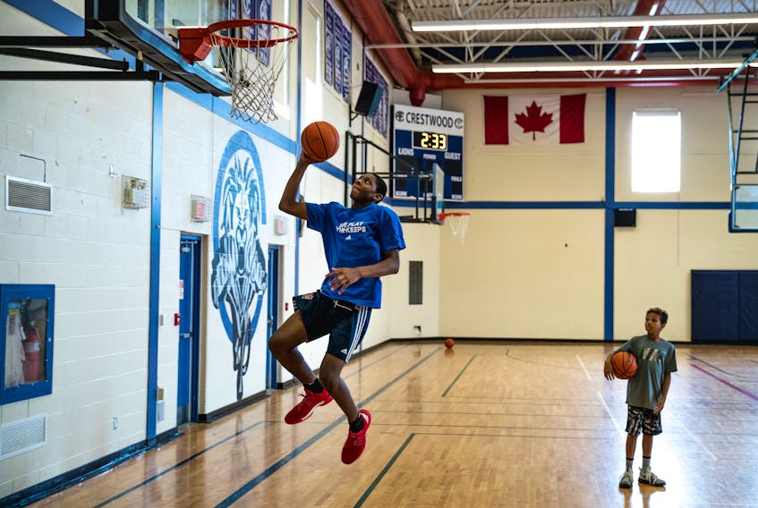 Canadian basketball prospect Elijah Fisher goes up for a layup at practice at Crestwood Preparatory College in Toronto. 