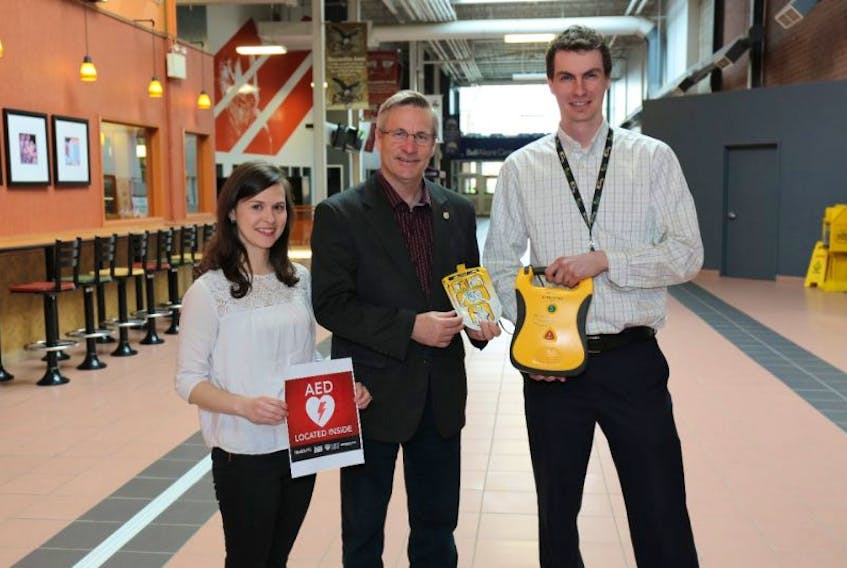 Minister of Health and Wellness Robert Henderson, centre, was joined by Heart and Stroke P.E.I. manager Sarah Crozier and Island EMS dispatch centre operations manager Matt Spidel to announce new emergency health technology, including a provincial automatic external defibrillator registry.