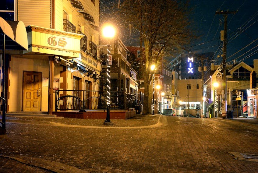 A usually bustling George Street would be full of patrons and partners at this time on a Friday night but the popular bar strip sits completely empty due to COVID-19 restrictions.