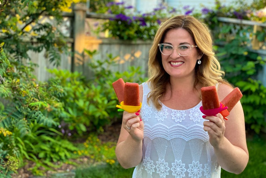 These homemade peach popsicles lasted 10 minutes and I quickly found out, they are neighbour approved. Yes, one may have made it over that fence after the photo. PAUL PICKETT PHOTO 