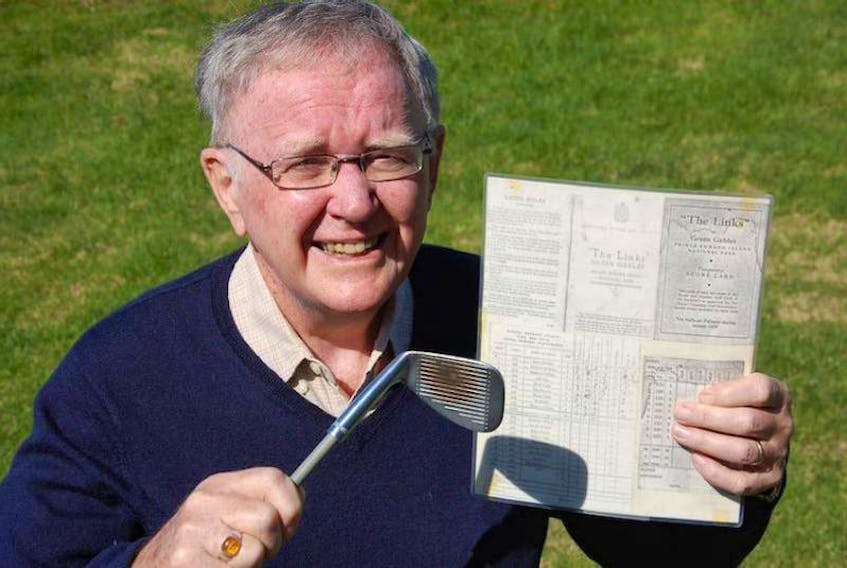 Errol Nicholson, who was the golf pro at Green Gables for 40 years, holds a score card from 1939 — the year Prince Edward Island's second oldest golf course opened for business. Nicholson also holds his old pitching wedge that hit more than balls on the course.
(The Guardian/Jim Day)