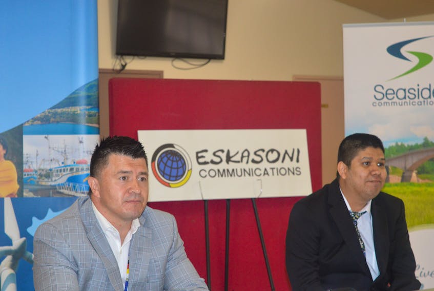 Chief Leroy Denny, left, and honorary witness Blake Bernard are seen at the official partnership signing of Eskasoni Communications and Seaside Communications Inc. Oscar Baker III/Cape Breton Post