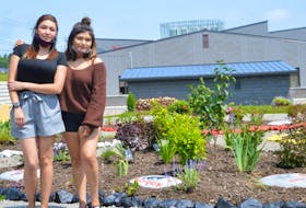 Jeannine Faye Denny, left, and Dionne Denny say they're grateful to see the foundation of the memorial garden built after years of planning. The garden is erected just outside of the Eskasoni Mental Health building. OSCAR BAKER III/CAPE BRETON POST