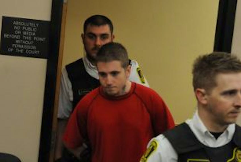 ['<p>Sheriff’s officers escort 22-year-old Evan James Fry as he enters courtroom six at St. John’s Provincial Court Wednesday morning.</p>']