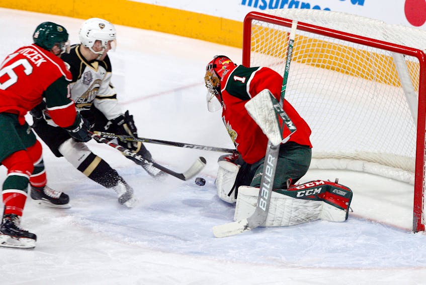 Halifax Mooseheads goaltender Alexis Gravel makes a pad save on Charlottetown Islanders forward William Sirman early in the first period Saturday at at the Scotiabank Centre in Halifax. (ERIC WYNNE/Chronicle Herald)