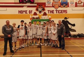The Exploits Valley High Eagles male basketball team recently won the gold medal at the 4th annual Caroline Penney Memorial Tiger Cup in Torbay, after a 90-61 victory over the host Holy Trinity Tigers in the final. Members of the team include, front row, from left, coach Nathan Sullivan, Evan Pardy, Adam Cooke, Kyle Bursey, Sevan Steele, Steven Mercer, Colton Connors, Ethan Lush, Josh Oldford, Colin O’Driscoll, Ethan Pardy and coach Brian Cooke; back row, from left, Andrew Welsh and Aiden Decker. CONTRIBUTED